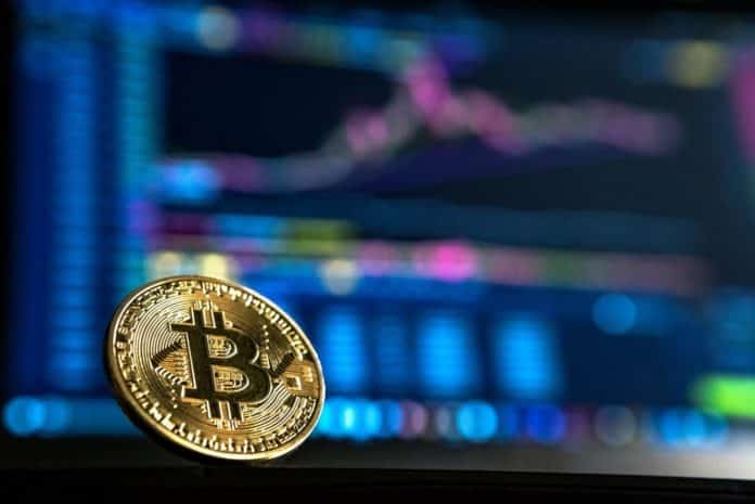 Bitcoin graf v pozadí Bitcoin BTC